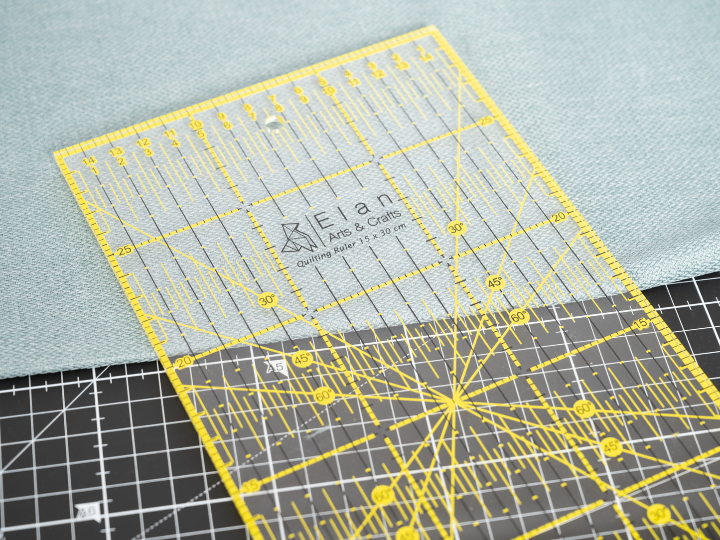 Scenic view of the Elan quilting ruler used on a black cutting mat.